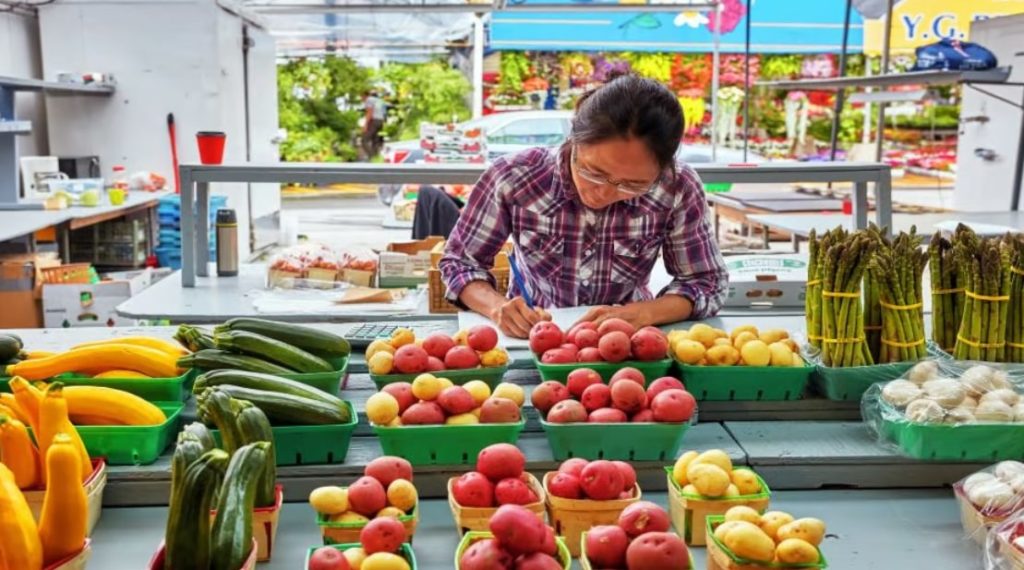 Woman taking notes of fruits and vegetables