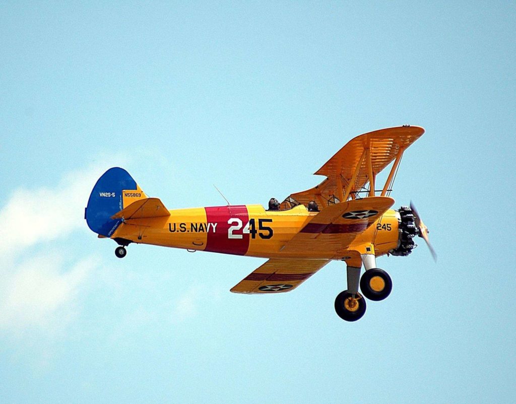 Soar through the skies on an authentic vintage aircraft